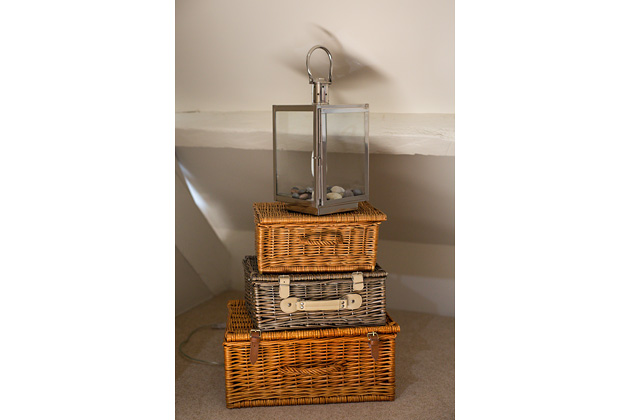 Tractor Cottage's lounge, stacked baskets