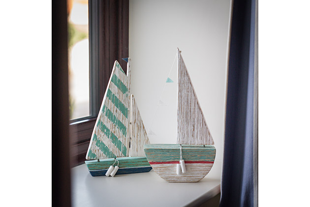 Tractor Cottage's double bedroom, sailing boat models in window