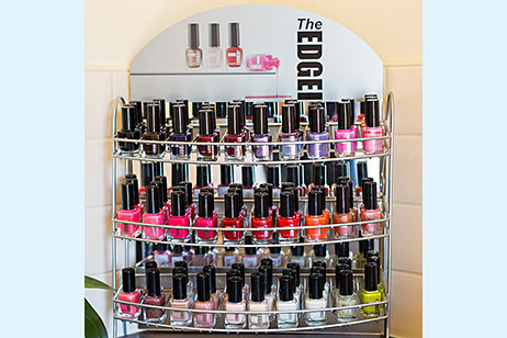 Display stand of bottles of The Edge nail colours