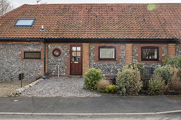 Tractor Cottage (front door is next to the circular window)