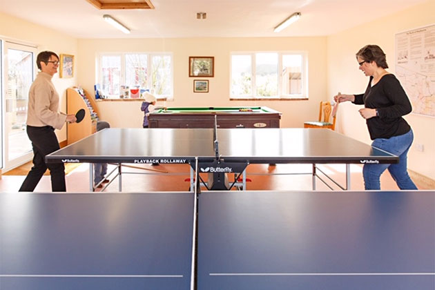 Table tennis in progress in the games room